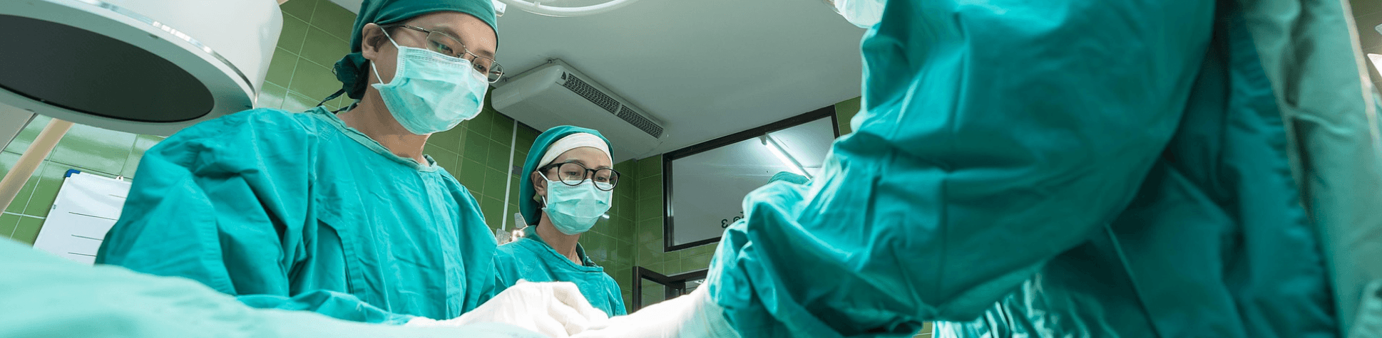 Doctors working together with a patient.